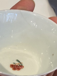 A pair of Chinese famille rose cups and saucers, Yongzheng