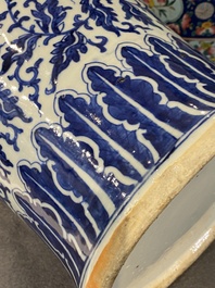 A pair of Chinese blue and white covered vases with floral sprigs, 19th C.
