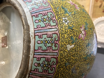 A large Chinese famille rose yellow-ground bottle vase, Qianlong mark, 19th C.