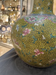 A large Chinese famille rose yellow-ground bottle vase, Qianlong mark, 19th C.