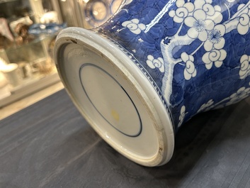 A Chinese blue and white 'prunus on cracked ice' vase and cover, Kangxi