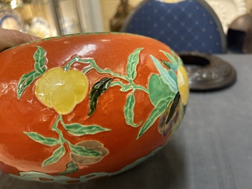 A Chinese relief-decorated alms bowl with wooden lid, Qianlong mark, 19/20th C.