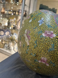 A large Chinese famille rose yellow-ground bottle vase, Qianlong mark, 19th C.