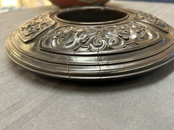 A Chinese relief-decorated alms bowl with wooden lid, Qianlong mark, 19/20th C.