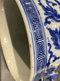 A pair of Chinese blue and white covered vases with floral sprigs, 19th C.