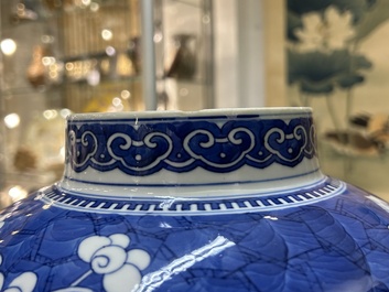 A Chinese blue and white 'prunus on cracked ice' vase and cover, Kangxi