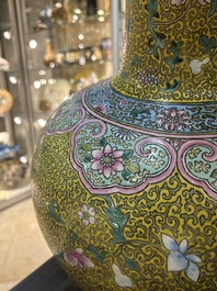 A large Chinese famille rose yellow-ground bottle vase, Qianlong mark, 19th C.