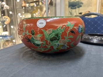 A Chinese relief-decorated alms bowl with wooden lid, Qianlong mark, 19/20th C.