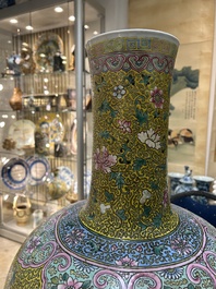 A large Chinese famille rose yellow-ground bottle vase, Qianlong mark, 19th C.