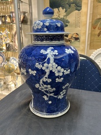 A Chinese blue and white 'prunus on cracked ice' vase and cover, Kangxi