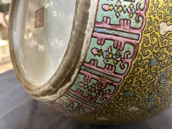 A large Chinese famille rose yellow-ground bottle vase, Qianlong mark, 19th C.