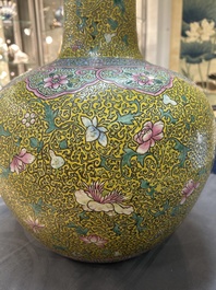 A large Chinese famille rose yellow-ground bottle vase, Qianlong mark, 19th C.