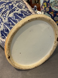 A pair of Chinese blue and white covered vases with floral sprigs, 19th C.