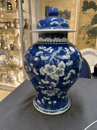 A Chinese blue and white 'prunus on cracked ice' vase and cover, Kangxi