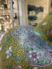 A large Chinese famille rose yellow-ground bottle vase, Qianlong mark, 19th C.