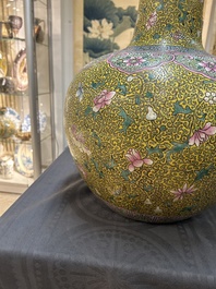 A large Chinese famille rose yellow-ground bottle vase, Qianlong mark, 19th C.