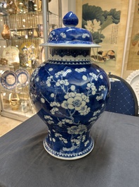 A Chinese blue and white 'prunus on cracked ice' vase and cover, Kangxi