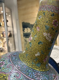 A large Chinese famille rose yellow-ground bottle vase, Qianlong mark, 19th C.