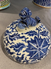A pair of Chinese blue and white covered vases with floral sprigs, 19th C.