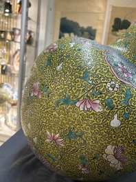 A large Chinese famille rose yellow-ground bottle vase, Qianlong mark, 19th C.