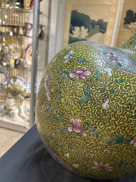 A large Chinese famille rose yellow-ground bottle vase, Qianlong mark, 19th C.