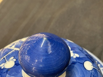 A Chinese blue and white 'prunus on cracked ice' vase and cover, Kangxi