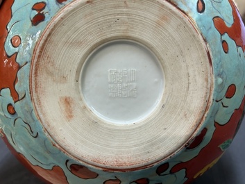 A Chinese relief-decorated alms bowl with wooden lid, Qianlong mark, 19/20th C.