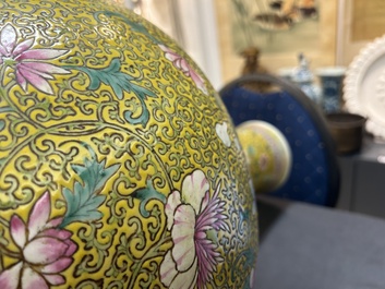 A large Chinese famille rose yellow-ground bottle vase, Qianlong mark, 19th C.