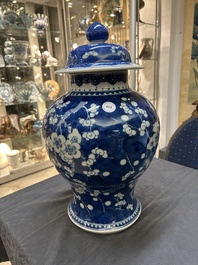 A Chinese blue and white 'prunus on cracked ice' vase and cover, Kangxi