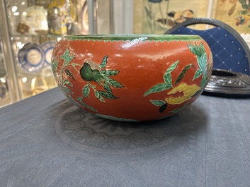 A Chinese relief-decorated alms bowl with wooden lid, Qianlong mark, 19/20th C.