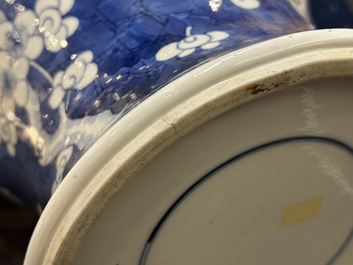 A Chinese blue and white 'prunus on cracked ice' vase and cover, Kangxi