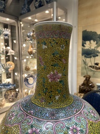 A large Chinese famille rose yellow-ground bottle vase, Qianlong mark, 19th C.
