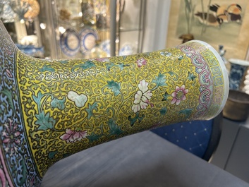 A large Chinese famille rose yellow-ground bottle vase, Qianlong mark, 19th C.