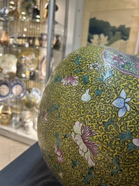 A large Chinese famille rose yellow-ground bottle vase, Qianlong mark, 19th C.