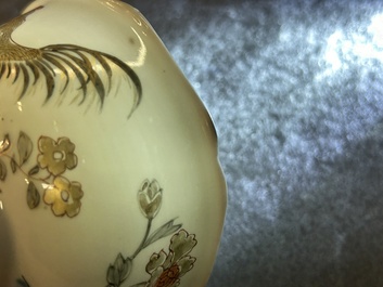 A Chinese grisaille and gilt 'roosters' cup and two saucers, Yongzheng