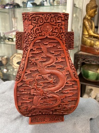 A Chinese red cinnabar lacquer 'fanghu' vase, 19/20th C.