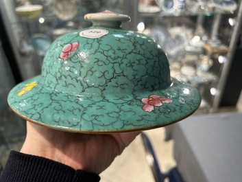 A Chinese turquoise-ground famille rose 'boys at a pomegranate tree' vase and cover, 19th C.