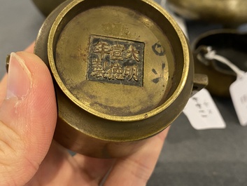 Three Chinese bronze censers and a silver-inlaid bronze vase, Qing