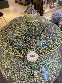A Chinese yellow-ground verte biscuit 'dragons' vase and cover, 19th C.
