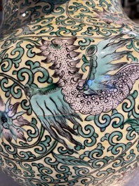 A Chinese yellow-ground verte biscuit 'dragons' vase and cover, 19th C.