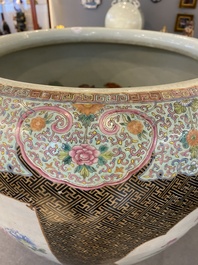 A large Chinese famille rose fish bowl on wooden stand, 19th C.