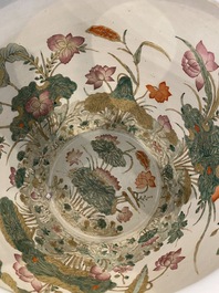 A large Chinese famille rose fish bowl on wooden stand, 19th C.
