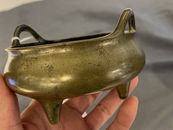Three Chinese bronze censers and a silver-inlaid bronze vase, Qing