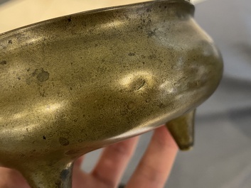 Three Chinese bronze censers and a silver-inlaid bronze vase, Qing