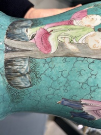 A Chinese turquoise-ground famille rose 'boys at a pomegranate tree' vase and cover, 19th C.