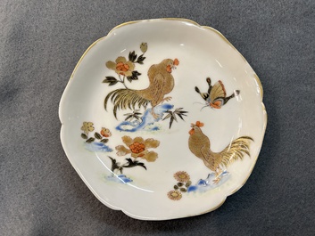 A Chinese grisaille and gilt 'roosters' cup and two saucers, Yongzheng