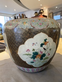 A large Chinese famille rose fish bowl on wooden stand, 19th C.