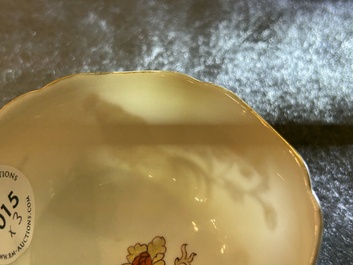 A Chinese grisaille and gilt 'roosters' cup and two saucers, Yongzheng