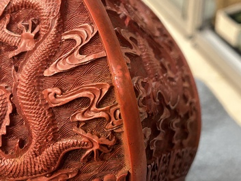 A Chinese red cinnabar lacquer 'fanghu' vase, 19/20th C.
