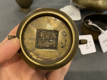 Three Chinese bronze censers and a silver-inlaid bronze vase, Qing